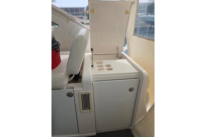 Slide: The Image of 2006 Tiara Yachts 3600 Open interior with seating and storage compartment. - 21