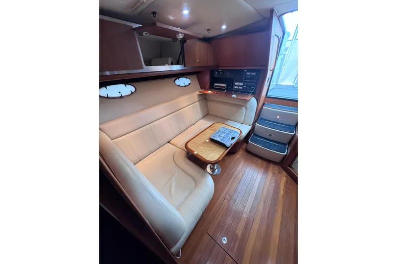 Slide: The Image of Luxurious interior of 2006 Tiara Yachts 3600 Open, featuring elegant seating and wooden flooring. - 25