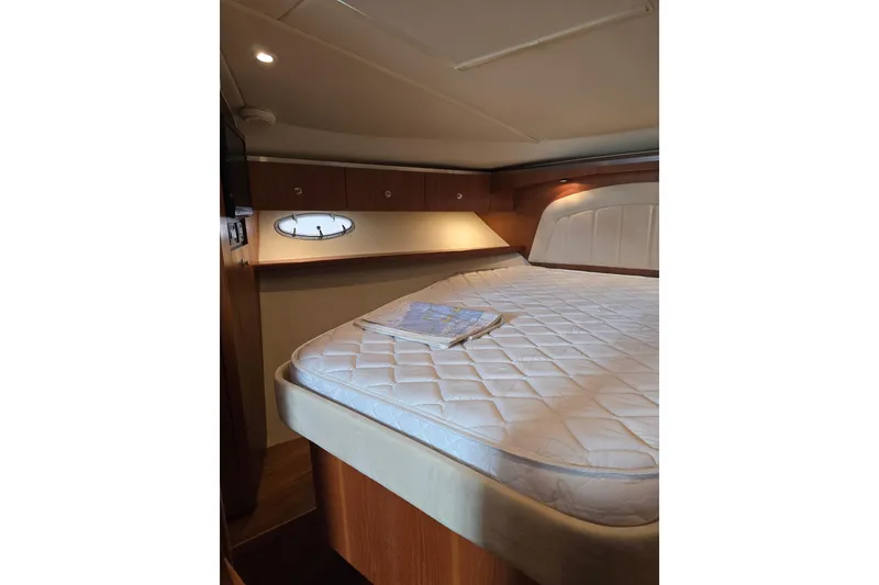 Slide: The Image of Luxurious cabin interior of 2006 Tiara Yachts 3600 Open with cozy bed and porthole. - 28