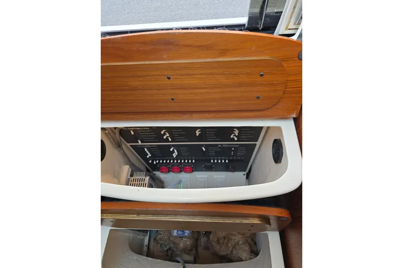 Slide: The Image of Electrical panel inside 2006 Tiara Yachts 3600 Open, featuring wooden cabinetry. - 30