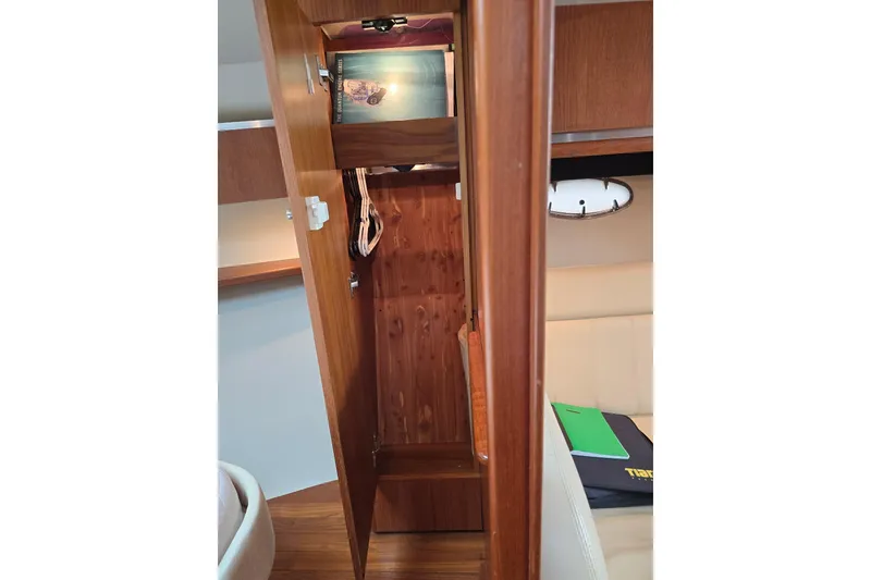 Slide: The Image of 2006 Tiara Yachts 3600 Open interior with wooden cabinetry and seating area. - 34