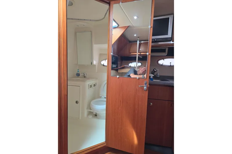 Slide: The Image of 2006 Tiara Yachts 3600 Open interior with bathroom and kitchenette. - 37