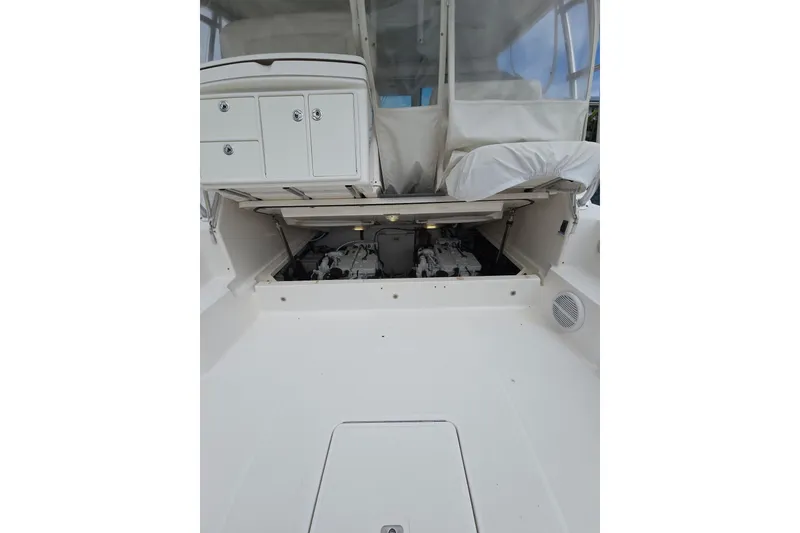 Slide: The Image of 2006 Tiara Yachts 3600 Open engine compartment with open hatch and storage cabinets. - 38