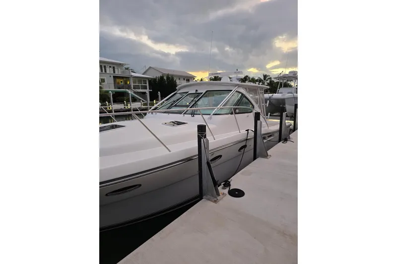 Slide: The Image of 2006 Tiara Yachts 3600 Open docked at marina during sunset. - 8