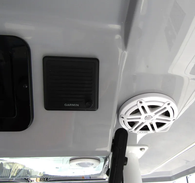 Slide: The Image of 2024 Wellcraft 352 Fisherman boat ceiling with Garmin speaker and white marine speaker. - 20