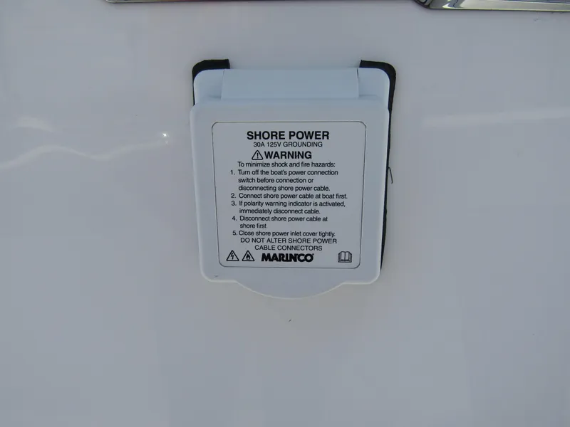 Slide: The Image of Shore power connection on a 2024 Wellcraft 352 Fisherman boat. - 28