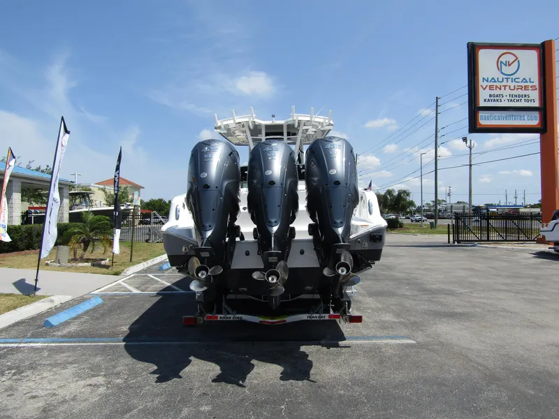 Slide: The Image of 2024 Wellcraft 352 Fisherman boat with triple outboard engines at Nautical Ventures. - 3