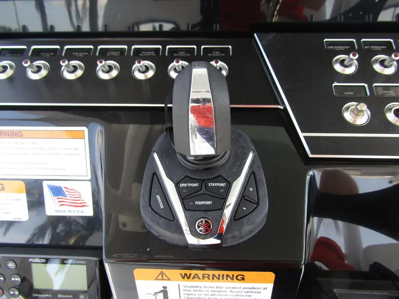 Slide: The Image of Control panel of 2024 Wellcraft 352 Fisherman boat with joystick and switches. - 23