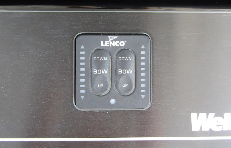 Slide: The Image of Lenco trim tab control panel on 2024 Wellcraft 352 Fisherman boat. - 26
