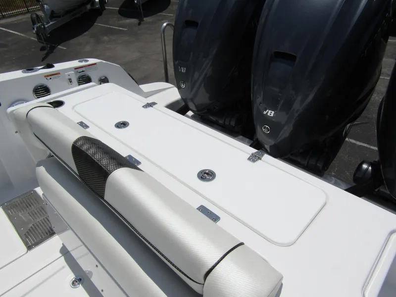 Slide: The Image of 2024 Wellcraft 352 Fisherman boat with dual outboard engines and cushioned seating. - 42