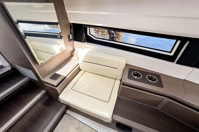 Slide: The Image of Interior of 2025 Wellcraft 38 Explorer yacht with seating and window view. - 33