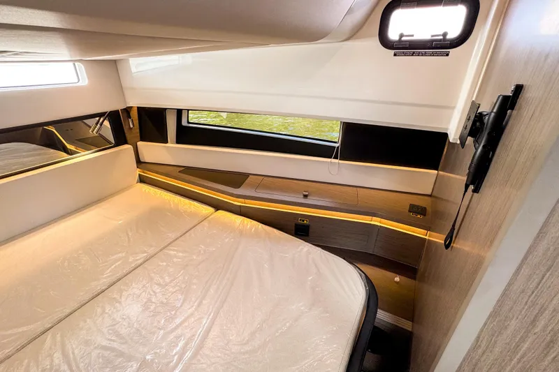 Slide: The Image of Luxurious cabin interior of 2025 Wellcraft 38 Explorer with cozy bedding and modern decor. - 37