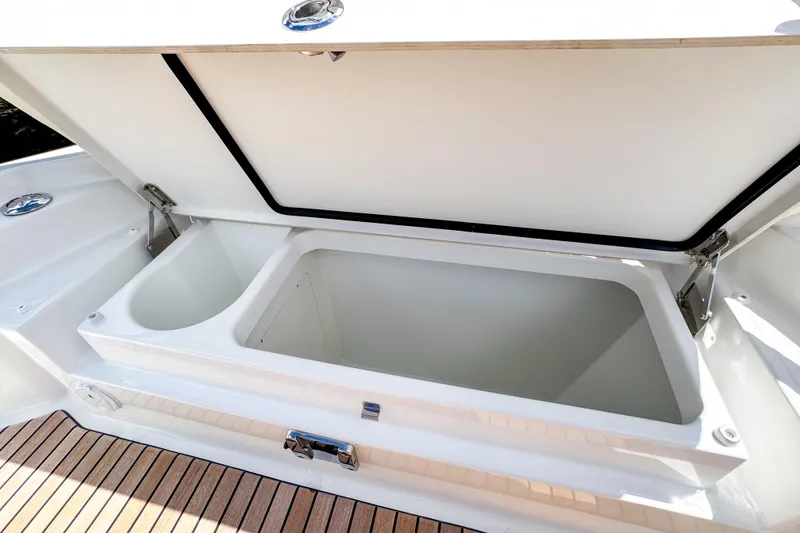 Slide: The Image of Open storage compartment on 2025 Wellcraft 38 Explorer boat, featuring sleek design and spacious interior. - 43