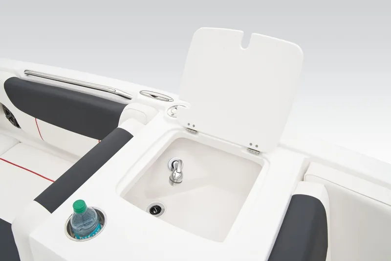 Slide: The Image of Storage compartment in 2026 Tahoe 2150 boat with plastic-wrapped equipment inside. - 25