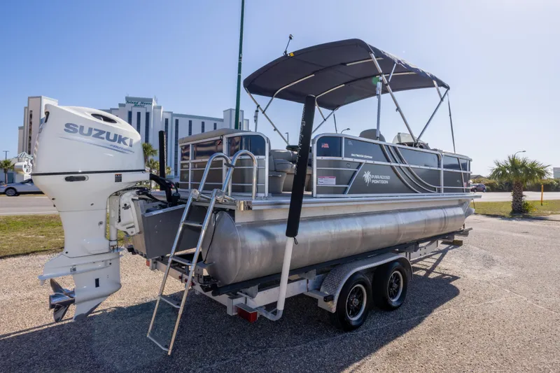 Slide: The Image of 2021 South Bay 222CR pontoon boat with Suzuki outboard motor on trailer. - 5