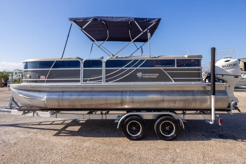 Slide: The Image of 2021 South Bay 222CR pontoon boat with canopy and Suzuki outboard motor. - 6