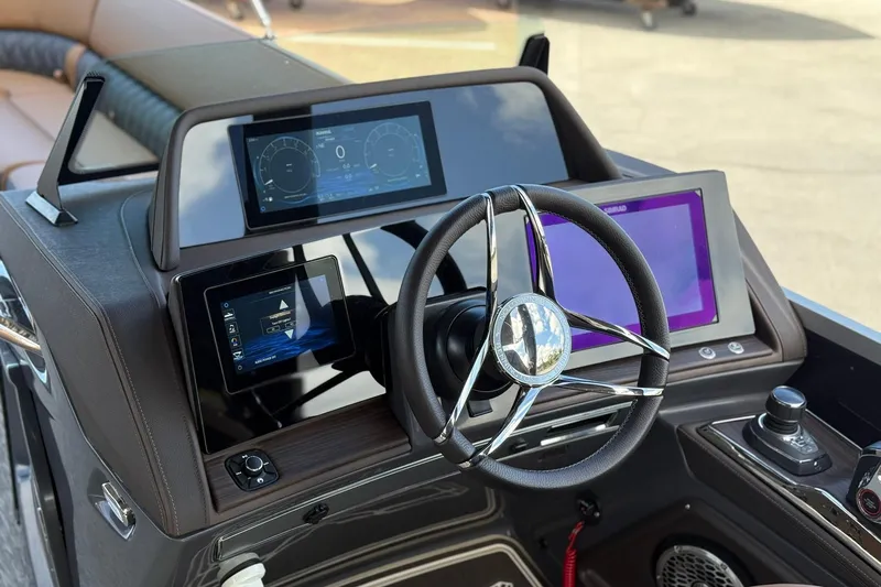 Slide: The Image of 2026 Bennington QX 30 QXSBA X2 Wide Beam boat dashboard with modern controls and displays. - 10