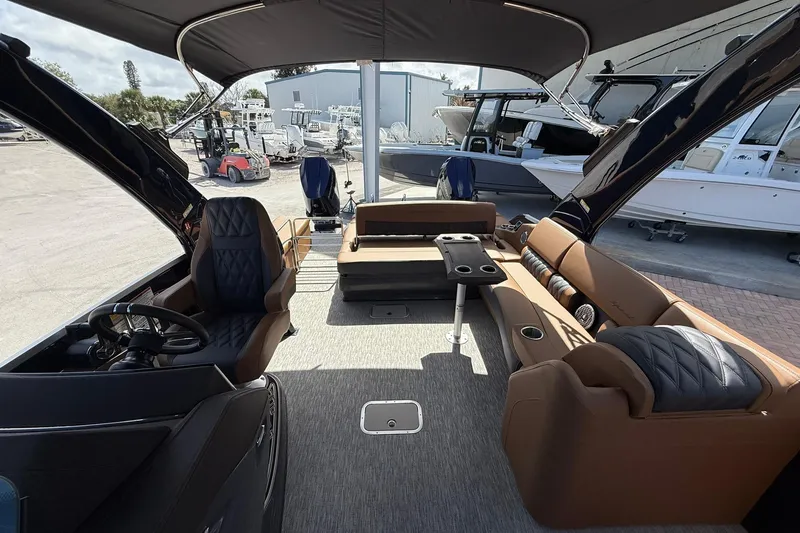 Slide: The Image of 2026 Bennington QX 30 QXSBA X2 Wide Beam interior with luxurious seating and modern design. - 11