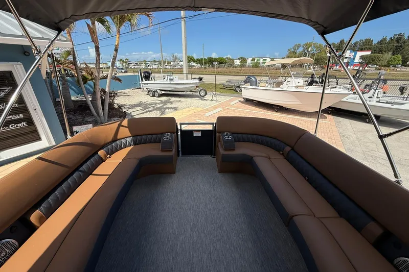 Slide: The Image of 2026 Bennington QX 30 QXSBA X2 Wide Beam boat interior with spacious seating and canopy. - 14