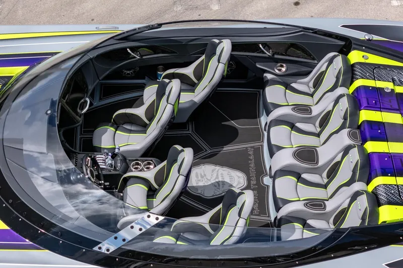 Slide: The Image of 2024 MTI 440X boat interior with sleek, modern seating and vibrant accents. - 22