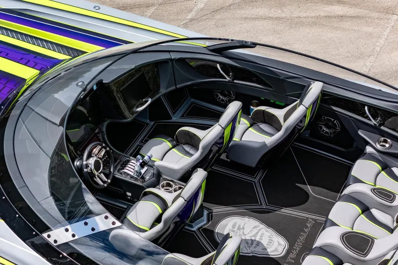 Slide: The Image of 2024 MTI 440X luxury speedboat interior with sleek design and vibrant seating. - 23