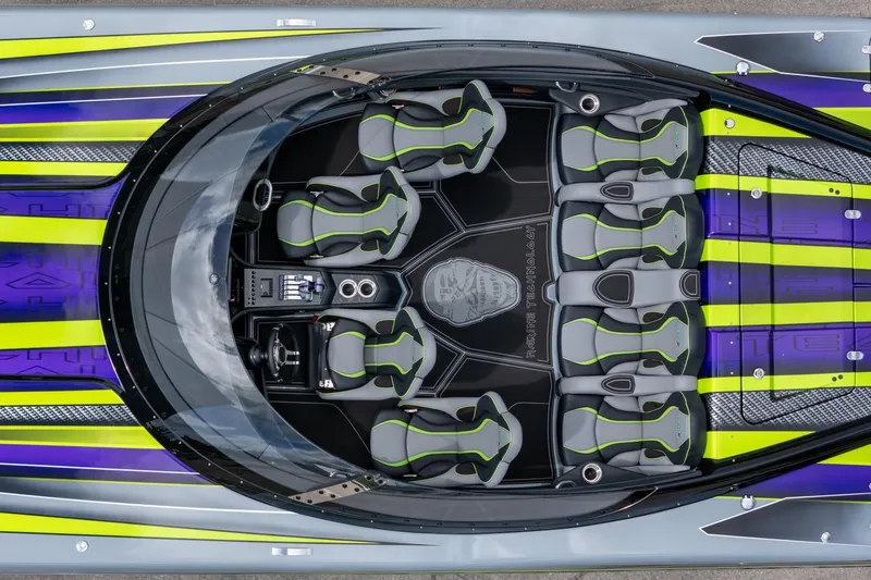 Slide: The Image of Top view of 2024 MTI 440X boat interior with vibrant seating and sleek design. - 24
