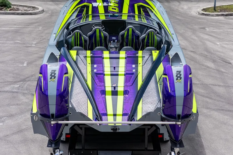 Slide: The Image of 2024 MTI 440X powerboat with vibrant purple and green design, featuring dual Mercury 500R engines. - 3
