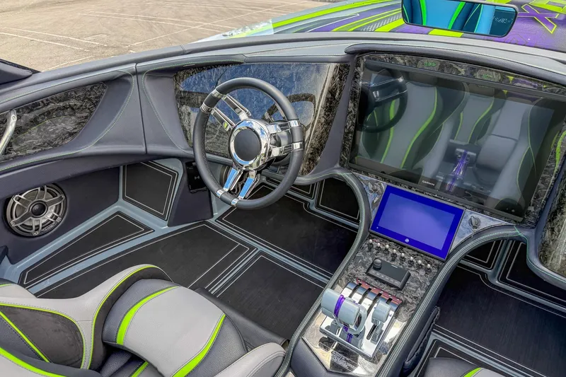 Slide: The Image of 2024 MTI 440X boat interior with modern steering wheel and advanced control panel. - 6