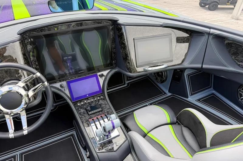 Slide: The Image of Interior of 2024 MTI 440X boat with modern dashboard and sleek design. - 7