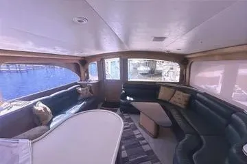 Slide: The Image of Luxurious interior of 1996 Buddy Davis 67 yacht with elegant seating and waterfront view. - 10