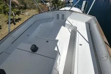 Slide: The Image of 1996 Buddy Davis 67 yacht deck with spacious seating and sleek design. - 6