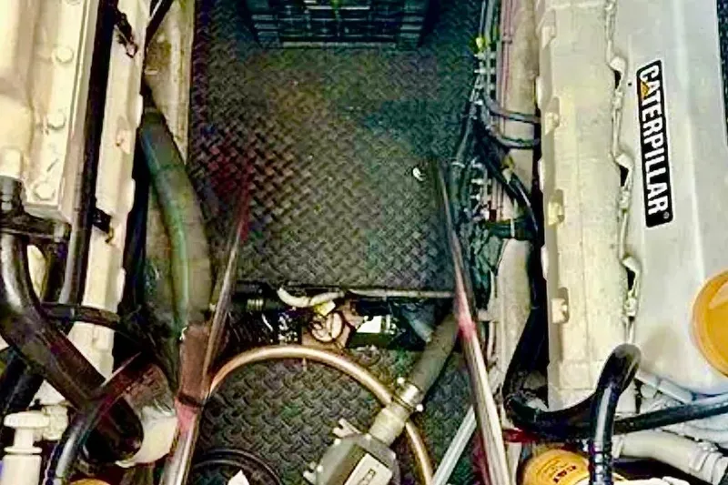 Slide: The Image of Engine room of a 2000 Tiara 37 Open boat with Caterpillar engine components. - 115