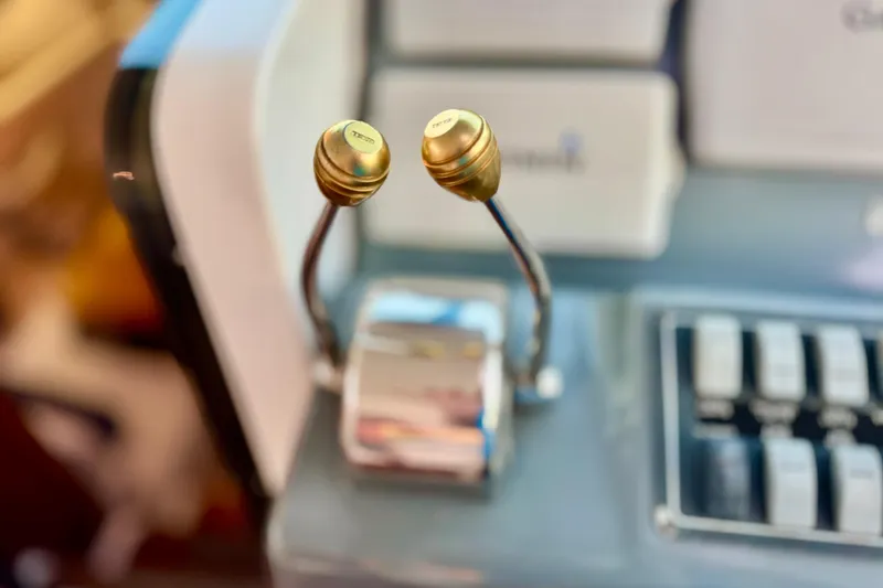 Slide: The Image of Close-up of Tiara 37 Open 2000 boat controls with gold levers. - 12