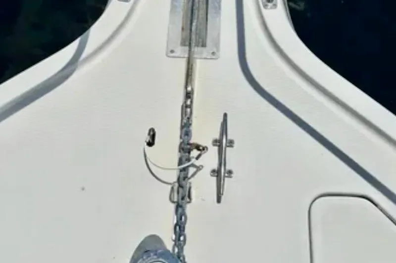 Slide: The Image of Bow of a 2000 Tiara 37 Open boat with anchor chain and cleat. - 88