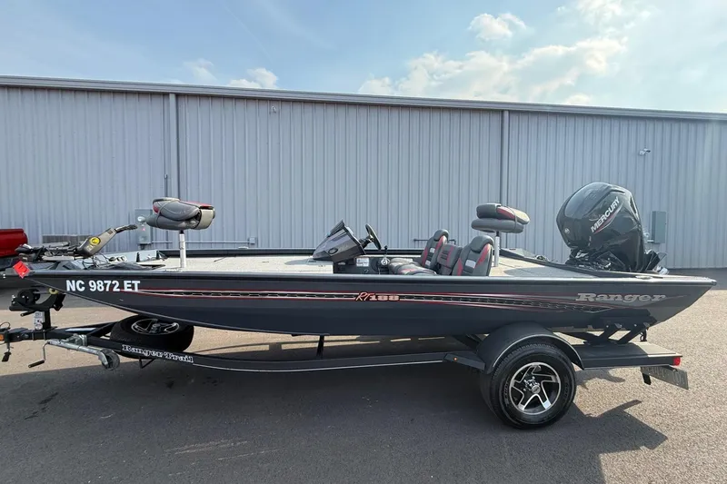 The Image of 2021 Ranger RT188 boat with Mercury engine, parked on trailer, side view. - 1
