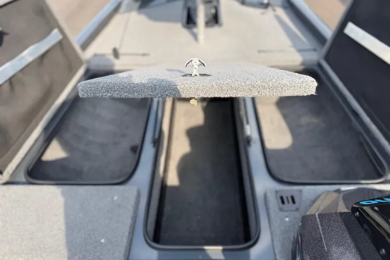Slide: The Image of 2021 Ranger RT188 boat storage compartments with open lid, showcasing interior space. - 10