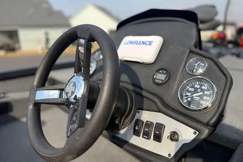 Slide: The Image of 2021 Ranger RT188 boat dashboard with steering wheel and gauges. - 6