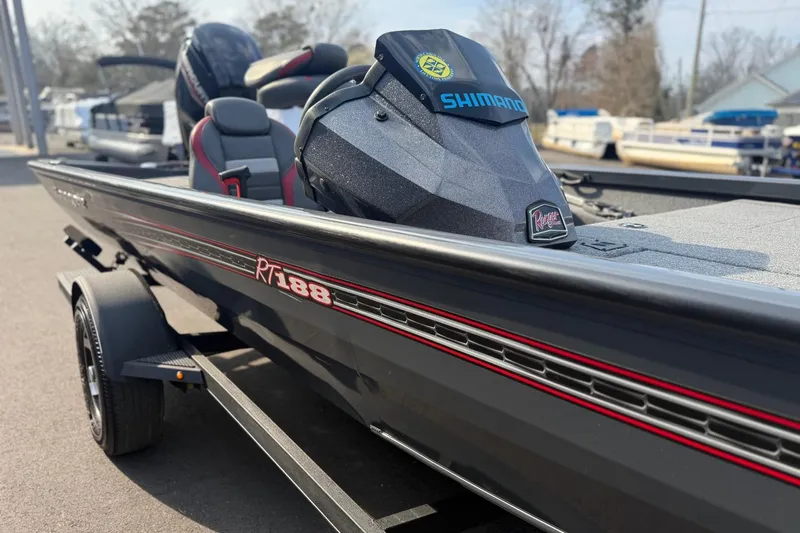 Slide: The Image of 2021 Ranger RT188 boat with Shimano motor, parked on a trailer. - 8