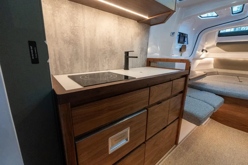Slide: The Image of Modern interior of 2027 Axopar 38 Cross Cabin with sleek kitchen and cozy seating area. - 29