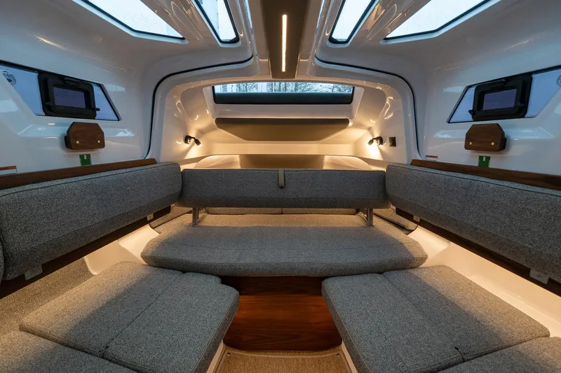 Slide: The Image of Interior of 2027 Axopar 38 Cross Cabin, featuring modern seating and ambient lighting. - 31