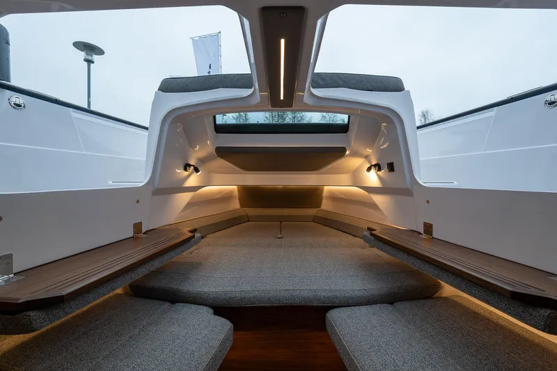 Slide: The Image of Interior of 2027 Axopar 38 Cross Cabin, featuring modern design and ambient lighting. - 34