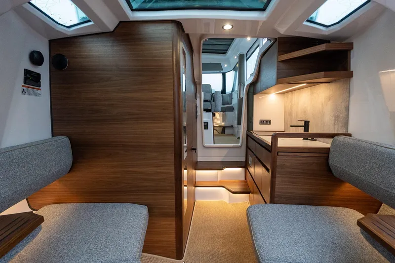 Slide: The Image of Interior of 2027 Axopar 38 Cross Cabin with modern wood and fabric design. - 36