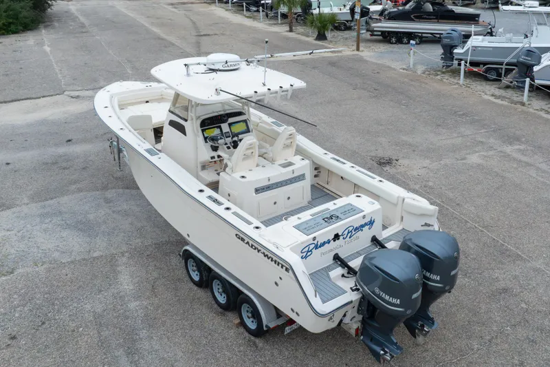 Slide: The Image of 2017 Grady-White Canyon 306 boat with dual Yamaha engines, parked on a trailer. - 10