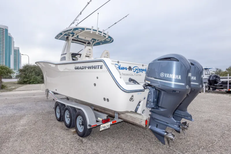 Slide: The Image of 2017 Grady-White Canyon 306 boat with dual Yamaha engines on a trailer. - 14