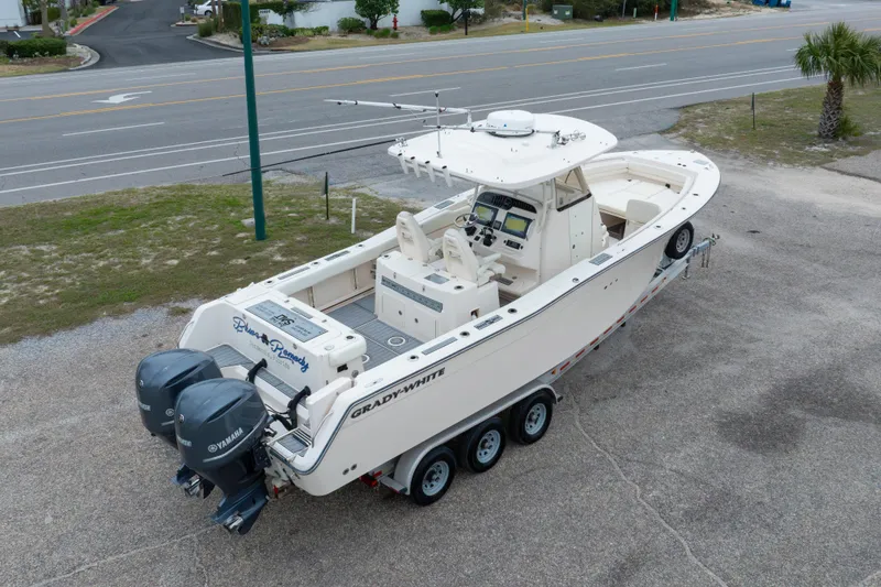 Slide: The Image of 2017 Grady-White Canyon 306 boat on trailer with dual Yamaha engines. - 19