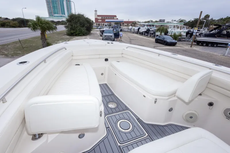 Slide: The Image of 2017 Grady-White Canyon 306 boat interior with white seating and gray flooring. - 27