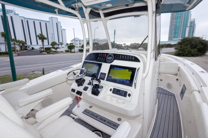 Slide: The Image of 2017 Grady-White Canyon 306 boat interior with modern navigation system and comfortable seating. - 30