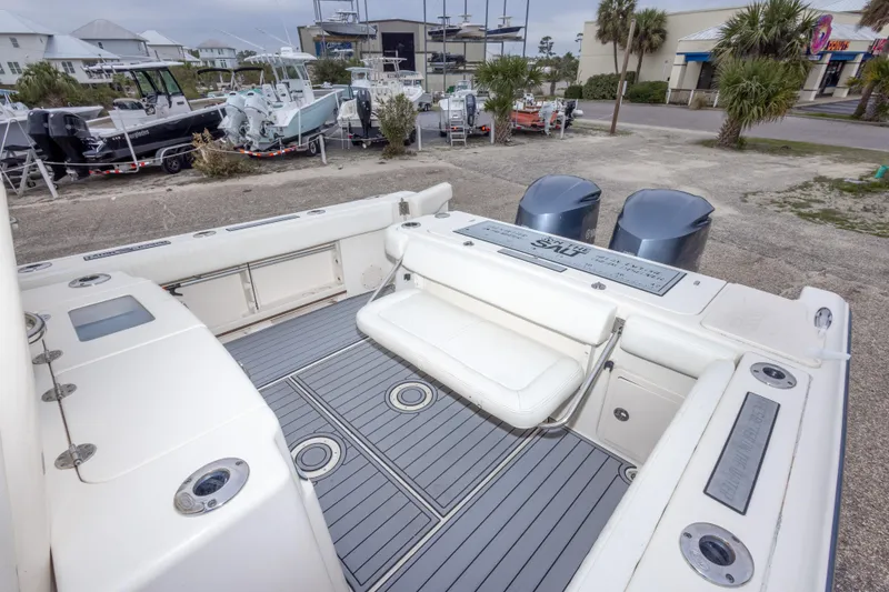 Slide: The Image of 2017 Grady-White Canyon 306 boat interior with seating and dual engines. - 40