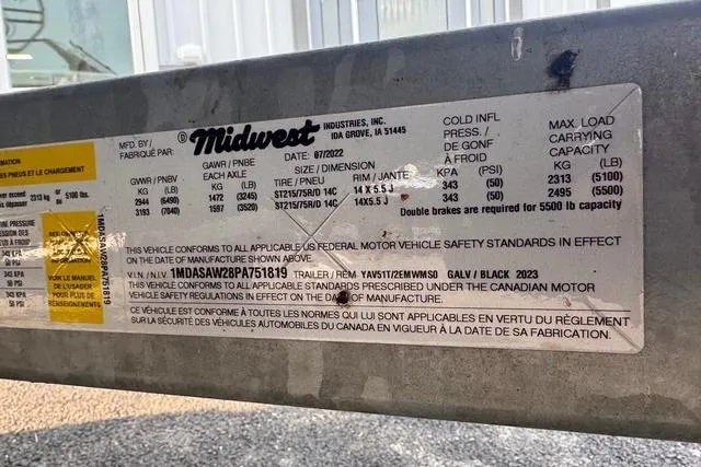 Slide: The Image of 2023 Yamaha Boats AR220 trailer label by Midwest Industries, detailing specifications and safety standards. - 11