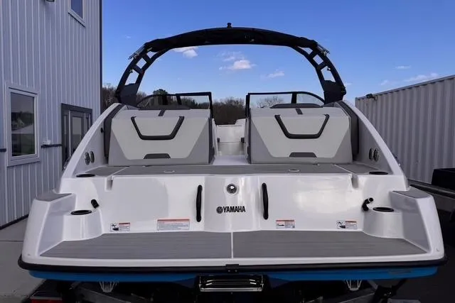 Slide: The Image of 2023 Yamaha Boats AR220, rear view, sleek design, modern features, outdoor setting. - 3